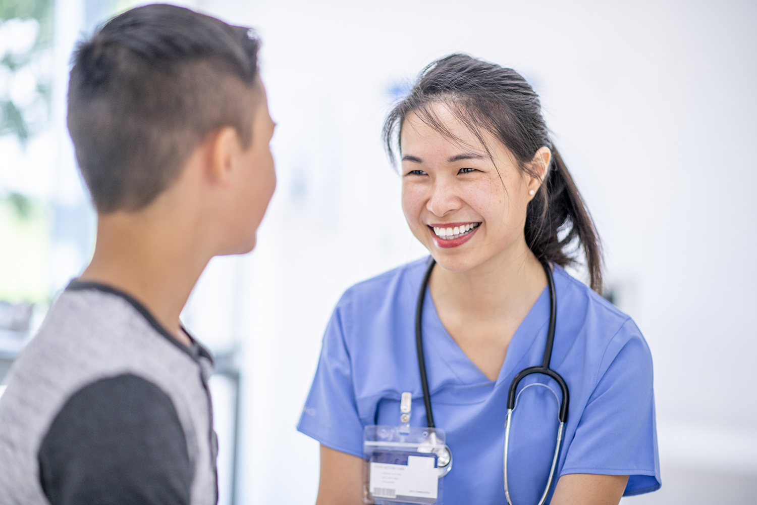 Young boy at medical appointment with a nurse