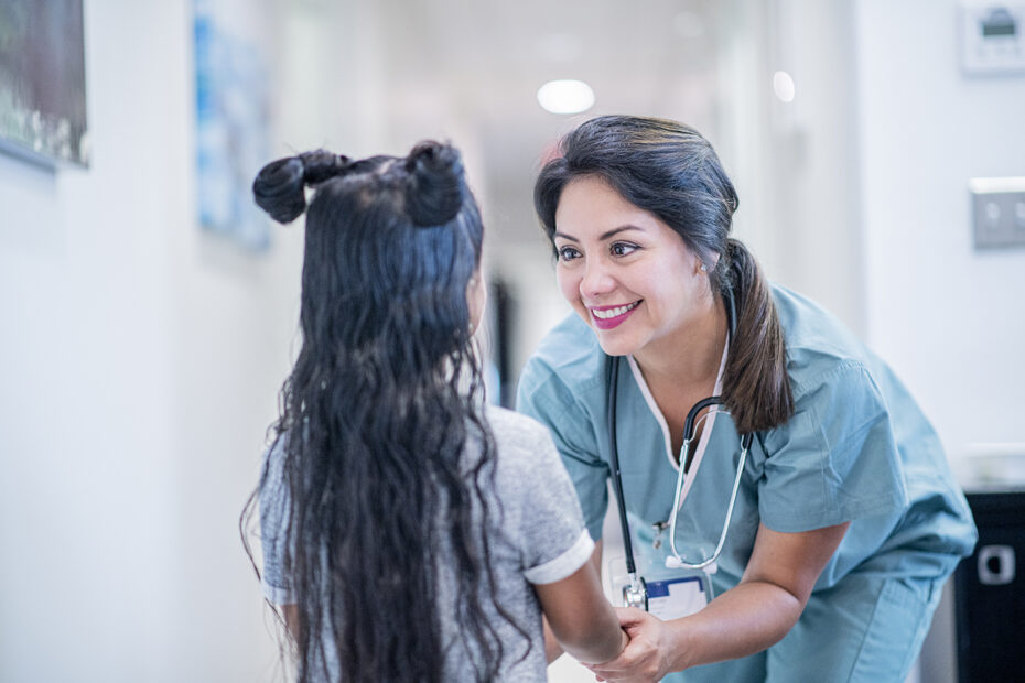Doctor Talking to a Little Girl stock photo
